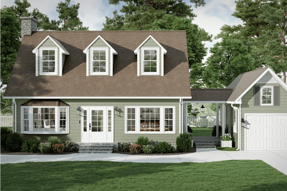 An Asheville home with green vinyl siding, energy-efficient windows, and a big white entry door.