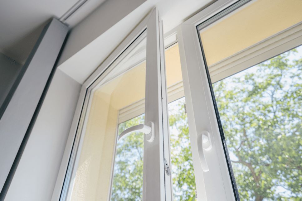 A casement window with handles, slightly open.