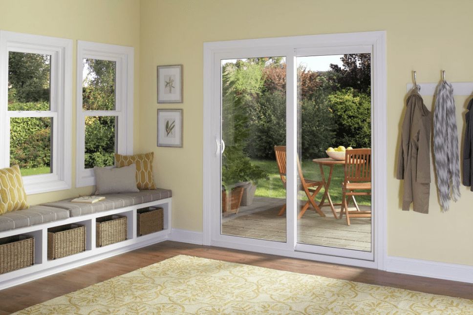 Sliding glass patio door separating a living room and outdoor space.